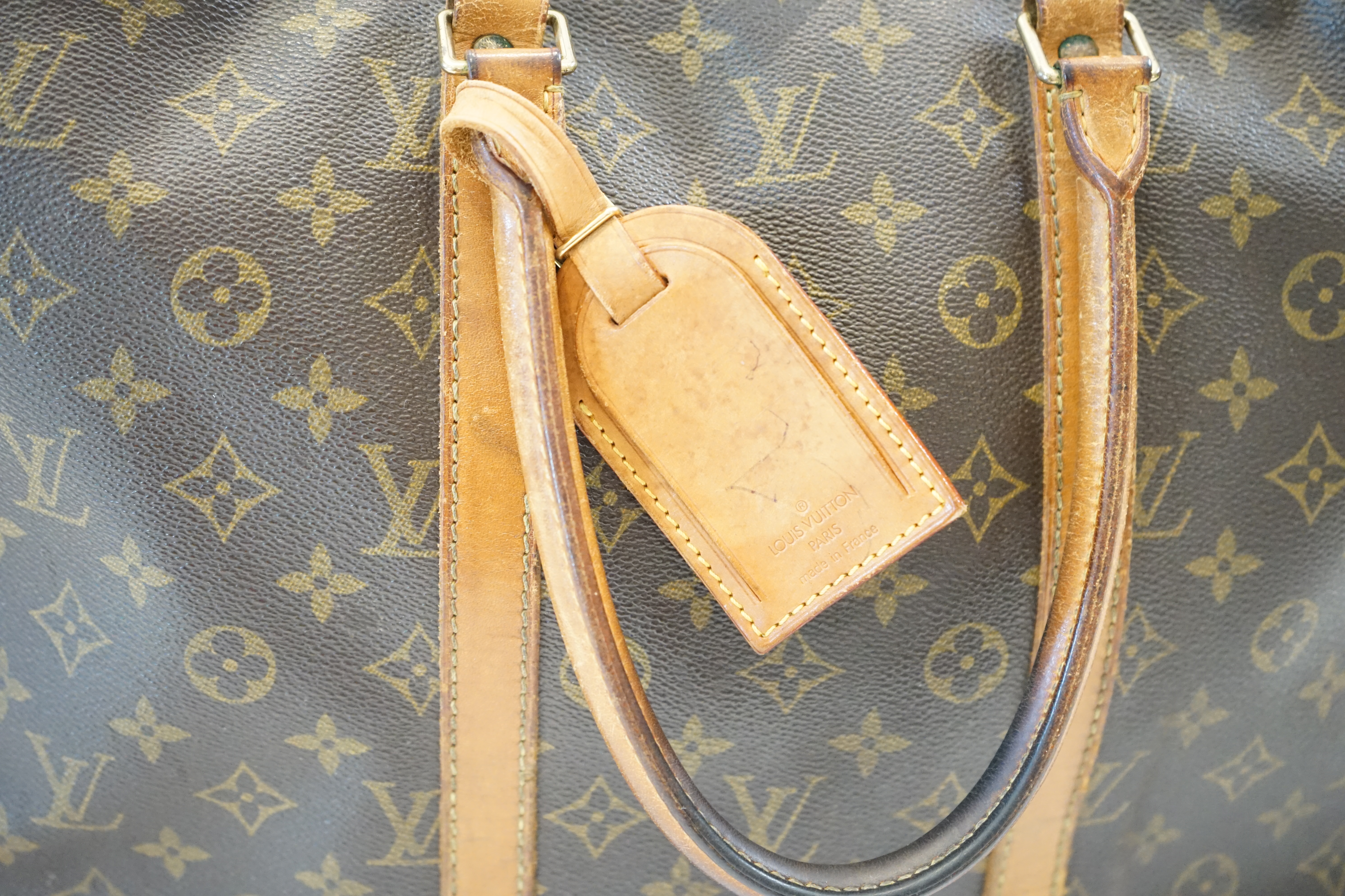 A Louis Vuitton Keepall leather travel bag with luggage tag width 13cm, length 45cm, height 30cm